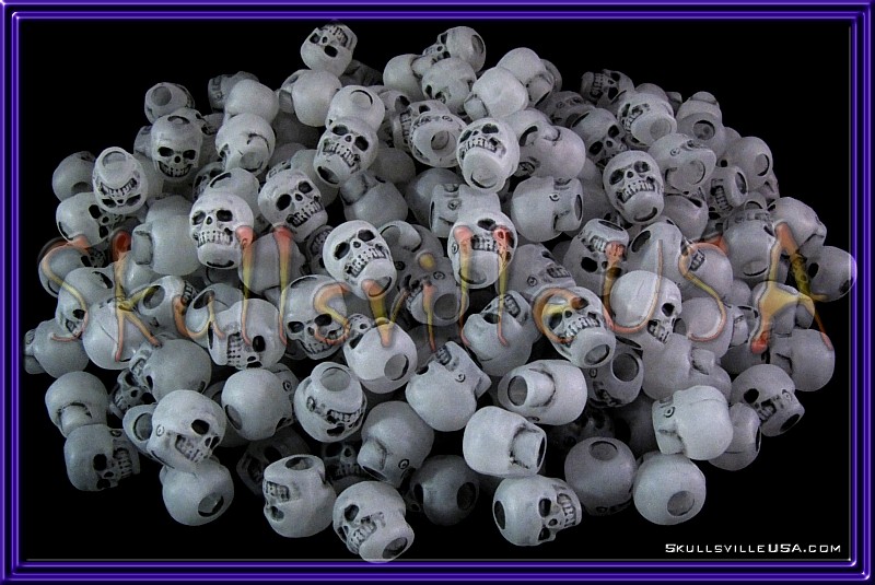 antiqued glow in the dark acrylic skull beads