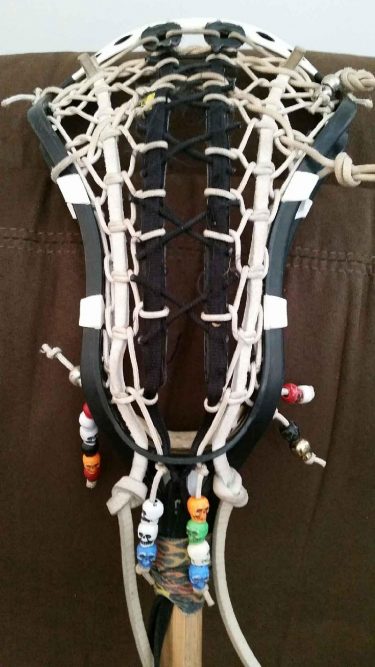 lacrosse stick or crosse with skull beads