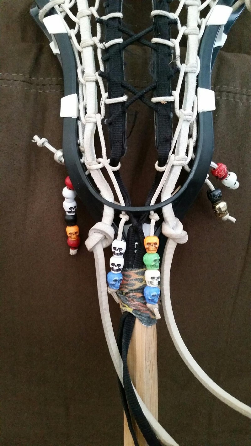 lacrosse stick or crosse with skull beads